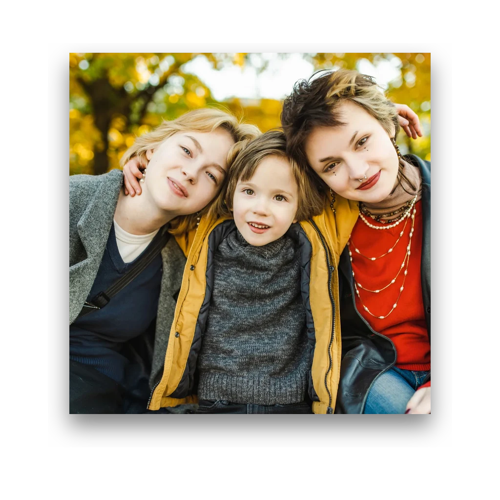 A mother hugging her two children outdoors, printed as a square photo magnet